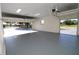 Spacious two-car garage with high ceilings and open doors at 13832 Bay Lake Rd, Groveland, FL 34736