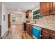 Modern kitchen with wood cabinets and white countertops at 13832 Bay Lake Rd, Groveland, FL 34736