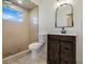 Bathroom features a walk-in shower, toilet, and vanity with a vessel sink at 13832 Bay Lake Rd, Groveland, FL 34736