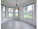 Breakfast nook with tiled floor and view of the backyard at 536 Grand Vista Trl, Leesburg, FL 34748