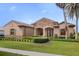 Exterior of a single-story house with stone accents at 25499 Hawks Run Ln, Sorrento, FL 32776