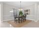 Elegant dining room with a chandelier and seating for six at 25499 Hawks Run Ln, Sorrento, FL 32776