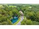 Community entrance with pond and lush landscaping at 25499 Hawks Run Ln, Sorrento, FL 32776
