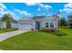 House exterior showcasing a lovely lawn and American flag at 7711 Sw 74Th Loop, Ocala, FL 34481