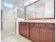Bathroom with double vanity and shower at 17106 Gathering Place Cir, Clermont, FL 34711