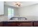 Stainless steel double sink with granite countertop at 17106 Gathering Place Cir, Clermont, FL 34711