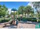 Community playground with play equipment and seating at 17106 Gathering Place Cir, Clermont, FL 34711