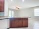 Kitchen island with granite countertop and stainless steel sink at 17106 Gathering Place Cir, Clermont, FL 34711