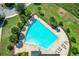 Inviting community pool with surrounding patio and chairs at 17106 Gathering Place Cir, Clermont, FL 34711