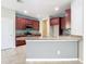 Modern kitchen with granite countertops and stainless steel appliances at 17106 Gathering Place Cir, Clermont, FL 34711