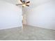 Large bedroom with tile floors and ceiling fan at 17106 Gathering Place Cir, Clermont, FL 34711