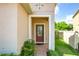 Inviting front entrance with a red door and brick walkway at 17106 Gathering Place Cir, Clermont, FL 34711