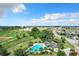 Community pool with cabana and surrounding landscape at 17106 Gathering Place Cir, Clermont, FL 34711