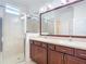 Bathroom with double vanity and shower at 17106 Gathering Place Cir, Clermont, FL 34711