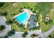 Aerial view of community pool, clubhouse, and playground at 17106 Gathering Place Cir, Clermont, FL 34711