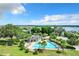 Aerial view of community pool with surrounding landscape at 17106 Gathering Place Cir, Clermont, FL 34711
