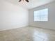 Well-lit bedroom with tile floors and window blinds at 17106 Gathering Place Cir, Clermont, FL 34711