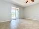 Bright living room with tile floors and sliding glass doors at 17106 Gathering Place Cir, Clermont, FL 34711