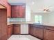 Modern kitchen with granite countertops and stainless steel appliances at 17106 Gathering Place Cir, Clermont, FL 34711