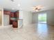 Kitchen with dark wood cabinets, granite counters, and stainless steel appliances at 17106 Gathering Place Cir, Clermont, FL 34711