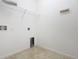 Laundry room with shelving and hook at 17106 Gathering Place Cir, Clermont, FL 34711