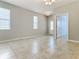 Spacious living room with tile floors and access to other rooms at 17106 Gathering Place Cir, Clermont, FL 34711