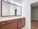 Bathroom with double vanity and view of bedroom at 17106 Gathering Place Cir, Clermont, FL 34711