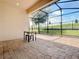 Screened patio with pavers and backyard view at 17106 Gathering Place Cir, Clermont, FL 34711