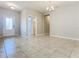 Bright and airy living room with tile flooring and neutral walls at 17106 Gathering Place Cir, Clermont, FL 34711