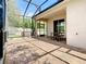 Outdoor patio with screened enclosure and paver stones at 17106 Gathering Place Cir, Clermont, FL 34711
