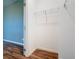 Walk-in closet with wire shelving and view of bedroom at 17106 Gathering Place Cir, Clermont, FL 34711