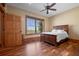 Bedroom with hardwood floors and a large window at 2499 Nw 102Nd Blvd, Wildwood, FL 34785