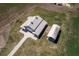 Aerial view of a barn and separate covered structure at 2499 Nw 102Nd Blvd, Wildwood, FL 34785