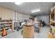 Garage with various tools and shelving units at 2499 Nw 102Nd Blvd, Wildwood, FL 34785