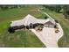 Aerial view of a spacious home on a large lot with a long driveway at 2499 Nw 102Nd Blvd, Wildwood, FL 34785