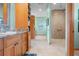Luxurious bathroom with a soaking tub, walk-in shower, and dual vanities at 2499 Nw 102Nd Blvd, Wildwood, FL 34785