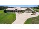 Aerial view of a single-Gathering home with a large yard and attached garage at 2499 Nw 102Nd Blvd, Wildwood, FL 34785
