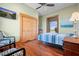 Bedroom with hardwood floors and two chairs at 2499 Nw 102Nd Blvd, Wildwood, FL 34785