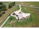 Aerial view showcasing a house, large lot, and extensive landscaping at 2499 Nw 102Nd Blvd, Wildwood, FL 34785