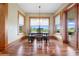 Bright breakfast nook with hardwood floors and views of the backyard at 2499 Nw 102Nd Blvd, Wildwood, FL 34785