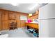 Laundry room with wooden cabinets and a sink at 2499 Nw 102Nd Blvd, Wildwood, FL 34785