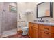 Bathroom with walk-in shower and granite vanity at 2499 Nw 102Nd Blvd, Wildwood, FL 34785