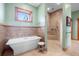 Spa-like bathroom with a large soaking tub and a walk-in shower at 2499 Nw 102Nd Blvd, Wildwood, FL 34785