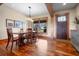 Spacious dining room features hardwood floors and a large window overlooking the golf course at 2499 Nw 102Nd Blvd, Wildwood, FL 34785