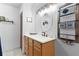 Charming bathroom with a wooden vanity and white sink at 4114 Dove Valley Ln, Lady Lake, FL 32159