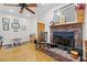 Brick fireplace with wooden mantel in living room at 4114 Dove Valley Ln, Lady Lake, FL 32159