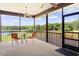 Relaxing screened porch overlooking a lake at 4114 Dove Valley Ln, Lady Lake, FL 32159