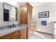 Double vanity bathroom with granite countertops and wood cabinets at 4114 Dove Valley Ln, Lady Lake, FL 32159