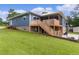 Back of house with deck and stairs at 4114 Dove Valley Ln, Lady Lake, FL 32159