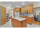 Bright kitchen boasts an island, stainless steel appliances, and lots of storage at 4114 Dove Valley Ln, Lady Lake, FL 32159